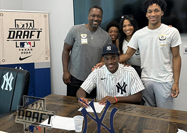 Dillion Lewis and family signing with the Yankees