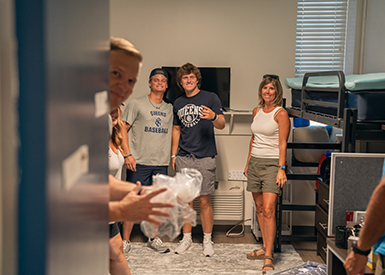 Family helping in dorm room on move-in day