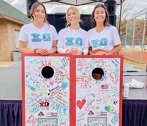 Chi Omega sisters at cornhole charity event
