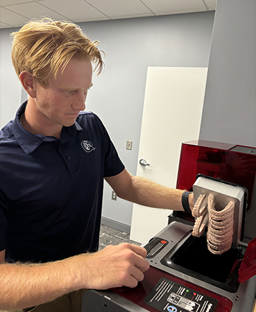 Luke Coppage making 3D printer teeth