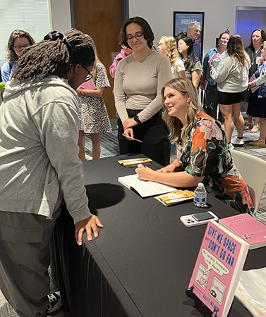 Author Haley signing books